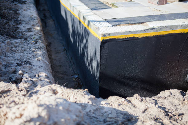 Professional Basement Waterproofing technician working in Farmington, PA